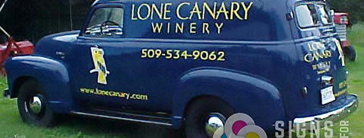 This lettering and logos on a classic car are a hit for Lone Canary Winery in Spokane and Spokane Valley