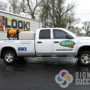 Attractive truck lettering by Signs for Success on clear wrap film for Scott's Lawn Service in Spokane