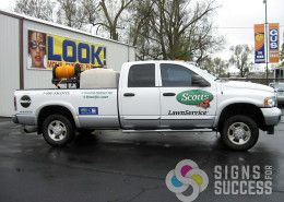 Attractive truck lettering by Signs for Success on clear wrap film for Scott's Lawn Service in Spokane