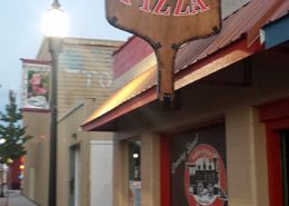 Station House Pizza has the best Pizza in Hillyard, Spokane, and the best sign, with a custom printed HUGE pizza paddle with their logo printed right on both sides