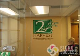 Add your logo to the boardroom wall or to the glass doors leading in, by Signs for Success Spokane