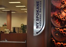 custom shaped wayfinding projecting wall sign for City of Spokane, on ACM panel, by Signs for Success