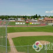 North Central High School sells advertising space on their fence with a discounted school program by Signs for Success now in Spokane