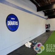 Adding a printed decal that conforms to your wall allows you to put up signs without penetrations, landlords love that, call Signs for Success now for fast service