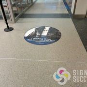 Riverpark Square added ads to the floor at Spokane International Airport with specially printed, laminated graphics that come off easily later, very nice by Signs for Success