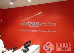 Verizon Wireless has brushed silver foil logo on their wall, it looks great with bright colored paint, looks like metal at a fraction of the cost, Signs for Success installed, Spokane