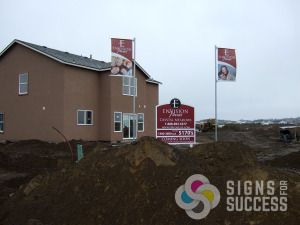 Construction Builders can use site signs and pole banners like Envision Homes in Airway Heights does