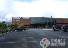 Worthy has Square Feet! large banners on Spokane Valley Building by Signs for Success in Spokane and Greenacres