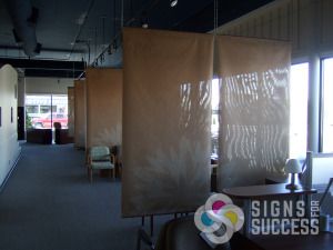 When Contract Design Associates in Spokane needed desk separation without blocking all the light, we used these mesh banners, double sided to create a great backdrop wall