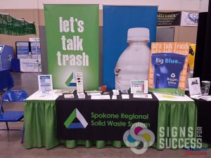 Tradeshow display for Spokane Regional Solid Waste System includes a table throw, retractable popup banner stands, easel posters and more, retractable banners spokane valley