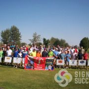 Advertisers and sponsors with banners at Gift of Golf Tournament in Post Falls and Cheney