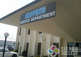 A building projecting sign or hanging sign will work for your business, Signs for Success can provide that sign for you