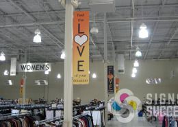 Give direction in a classy manner with projecting and hanging signs like The Arc in Spokane