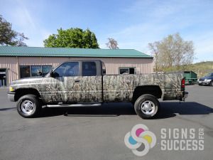 Signs for Success owner's camo truck graphics - side view