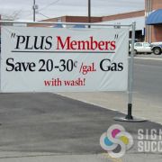 Banners can be installed on fences or on walls, very fancy and busy or very simple like this car wash banner done fast by Signs for Success in Spokane