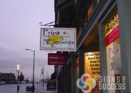 Frame and projecting hanging building street sign for Print Elements in Spokane