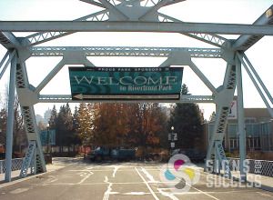 Riverfront Park in Spokane welcomes visitors with this large bridge banner by Signs for Success, call now for fast signs and banners, custom banner materials