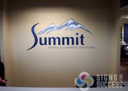 Printed and cut vinyl on wall is more affordable than dimensional letters and still looks great, like this for Summit Family & Cosmetic Dentistry Spokane