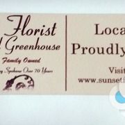 This small decal sticker label for Sunset Florist can be used on the flower bundles or packaging, done by Signs for Success in Spokane