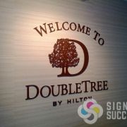 DoubleTree by Hilton hotel sign, dimensional laser cut acrylic, mounted to interior wall, Signs for Success for fast service in Spokane, call now