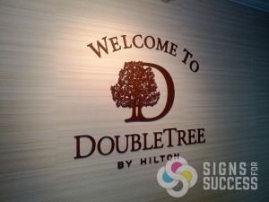 DoubleTree by Hilton hotel sign, dimensional laser cut acrylic, mounted to interior wall, Signs for Success for fast service in Spokane, call now