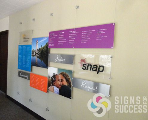 Dimensional look with cables and standoffs for Snap Spokane, designed, printed, installed by Signs for Success, call now for great, fast service, stand off signs