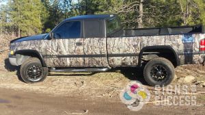 Dodge Ram pickup truck wraps with camo camouflage, non repeating pattern and matte black accents, by Signs for Success, Spokane
