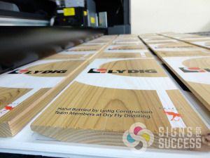 Printing a custom logo for Dry Fly bottle boxes makes a great corporate gift that will be long remembered, Signs for Success can print on your flat blanks, Give us a call now for fast sign service in Spokane, custom wood signs spokane