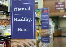 Flag mount grocery display sign, double sided, shelf hangers in Spokane, grocery store signs, green signs