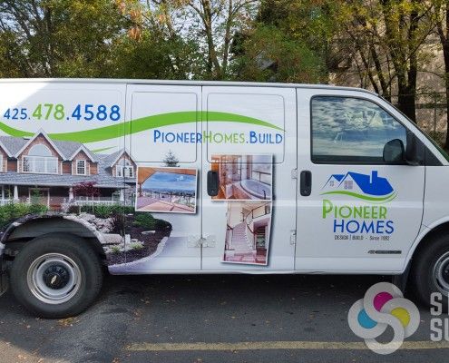 Pioneer Homes van wrap design featuring new logo, created by Signs for Success, get custom logo design Spokane